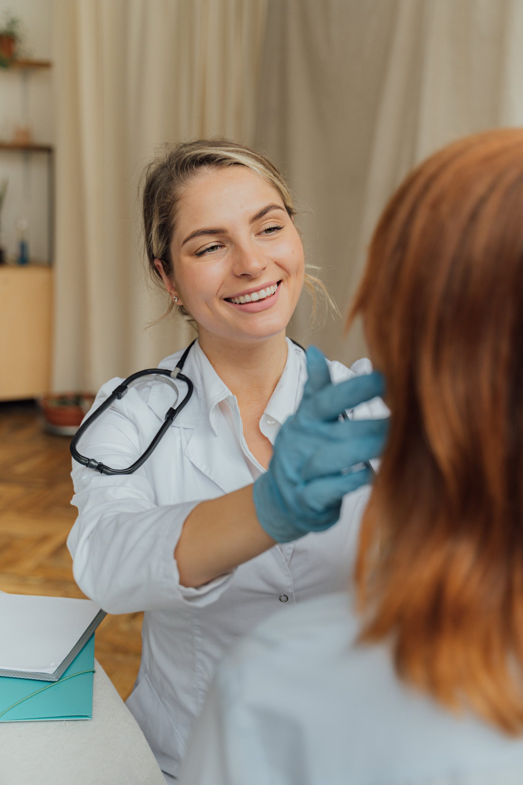 Photo of female doctor with patient